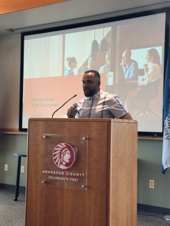 Calvin H., PTW customer, speaking at Coffee with Parents to Work!