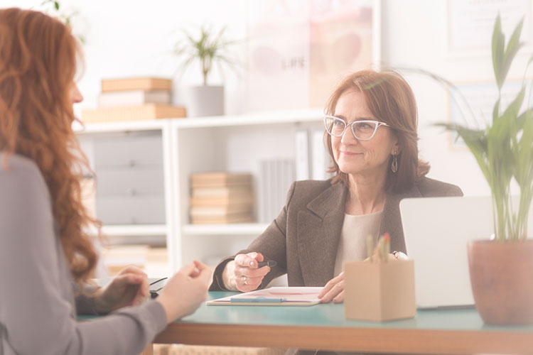 Woman interviewing with female manager in office